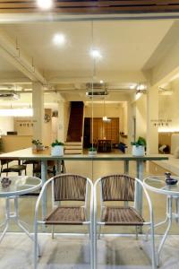 two chairs and a table in a room at Wonderful Bangkok in Bangkok