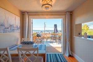 a dining room with a view of a deck at Old Tacoma Victorian Main Floor Duplex Unit in Tacoma