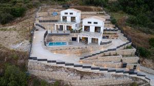 an aerial view of a house on a cliff at Aifantis Villa 1 in Póndi