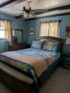 a bedroom with a bed and a ceiling fan at Serene A-frame Cabin Pet Friendly Panoramic View in Sun Valley