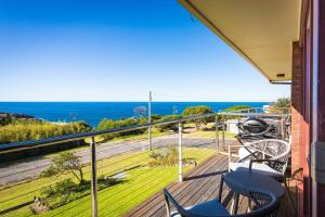 a balcony with chairs and a view of the ocean at Viewpoint in Tathra