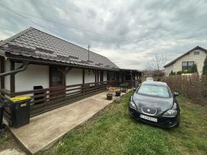 a car parked in front of a house at Fele&Ami house in Bontida