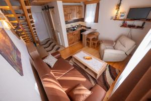 a living room with a couch and a table at Our House Apartments in Kolašin
