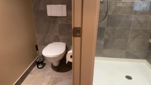 a bathroom with a toilet and a shower at Test Villa in Victoria