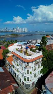 a large white building with plants on top of it at Las Clementinas in Panama City