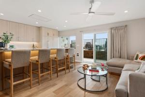 a kitchen and living room with a couch and a table at Carpinteria Shores CS 105 in Carpinteria