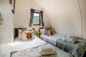 a room with two beds in a tiny house at 2 Bed in Corwen oc-80318 in Gwyddelwern