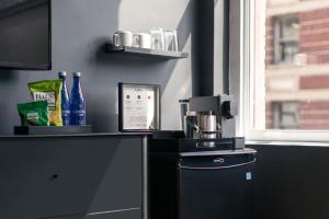 a kitchen with a coffee maker on a counter at Madison Square Studio at Return Policy Broadway in New York