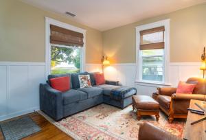 a living room with a couch and a chair at Magnolia Cottage in Santa Barbara +16 photos