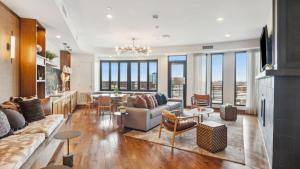 a living room with a couch and a table at Sentral Old Town in Scottsdale