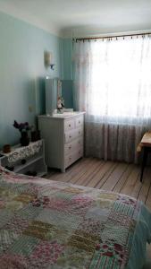 Eco-Apartment in Province Style tesisinde bir odada yatak veya yataklar