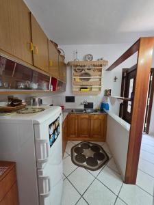 a kitchen with a sink and a dishwasher at Sidirounta Traditional Home 2 in Chios +8 photos