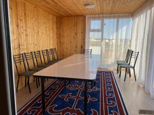 a dining room with a table and chairs at Esal Rest Zone in Tong