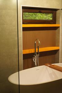 a bathroom with a sink and a window at Mestia Panorama in Mestia +58 photos