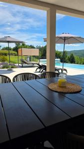 a black table with a candle on top of it at Villa Green Forest with wellness and heated salty pool in Hum