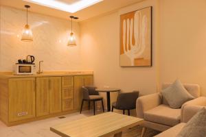 a living room with a couch and a table at شقق وسن الفندقية in Abha
