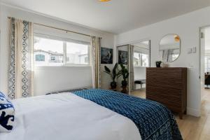 a bedroom with a bed and a large window at Bella Blu in Avila Beach +30 photos