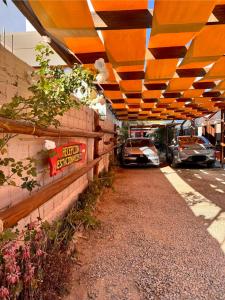 a car garage with cars parked on the side at Hostal del Suri in Cafayate