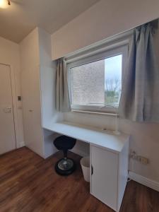 a room with a desk and a window at Ghent Business Flat in Ghent +14 photos
