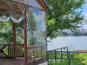 a gazebo with a view of a lake at BAVARO HOTEL and SPA in Oral
