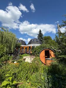 a building in the middle of a garden at Agroturystyka Rajski Ogród in Mysłakowice