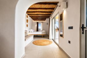 a hallway with a living room with a couch and a table at iLocal Premium Services suite in Zefiría