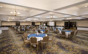 a large banquet hall with tables and chairs at Coast Prince George Hotel in Prince George +29 photos