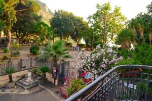 a park with a bunch of plants and flowers at Villa Luisetta Palmi in Palmi