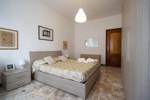 a bedroom with a bed with two pillows on it at oasi bengasi in Moncalieri
