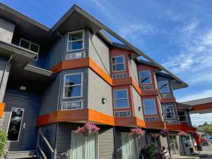 a colorful apartment building with colorful windows at Coast Parksville Hotel in Parksville