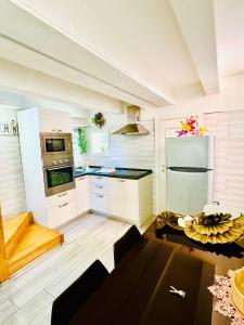 a kitchen with white cabinets and a stove top oven at San Marco Romantic Views in Venice