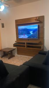 a living room with a flat screen tv at Estação lazer e Eventos in Mairinque