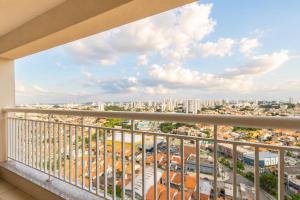 a balcony with a view of a city at Noble Studio 22209, Piscina, Vaga, Academia, Ar in Guarulhos