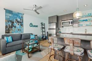 a living room with a couch and a kitchen at Sunset Shores Sunset Shores 246 in Carpinteria