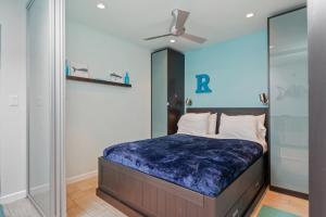 a bedroom with a bed and a glass wall at Sunset Shores Sunset Shores 246 in Carpinteria