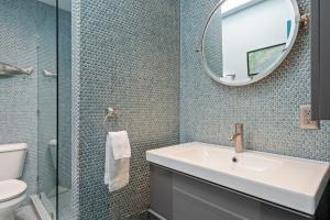 a bathroom with a sink and a mirror at Sunset Shores Sunset Shores 246 in Carpinteria