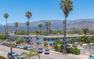 a parking lot with palm trees and buildings at Sunset Shores Sunset Shores 246 in Carpinteria