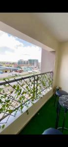 a balcony with a view of a city at 2 Bedroom Apartment Kitengela in Kitengela 
