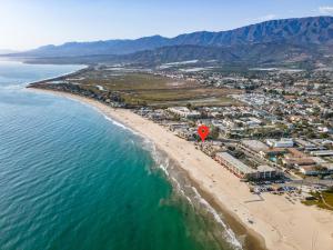 an aerial view of a beach and the ocean at Sandcastle in Carpinteria