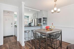 a kitchen with a table and chairs in a room at Seaside Retreat at Solimar Sands in Carpinteria