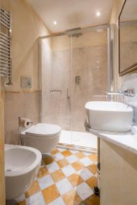 a bathroom with two sinks and a shower at Novella House in Florence