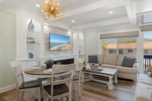 a living room with a table and a couch at Sandbox at Solimar Sands in Carpinteria