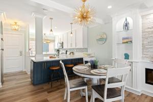 a kitchen and dining room with a table and chairs at Sandbox at Solimar Sands in Carpinteria +18 photos