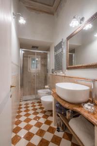 a bathroom with a sink and a toilet and a shower at Novella House in Florence