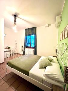 a bedroom with a large bed in a room at Podere al Fico B&B in Cecina