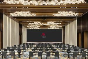 a conference room with chairs and a projection screen at Beijing Marriott Hotel Huairou in Huairou +40 photos