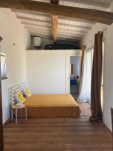 a bedroom with a bed and a table in a room at Il Respiro degli Ulivi in Viterbo