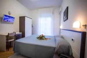 Postel nebo postele na pokoji v ubytování Hotel Caraibi