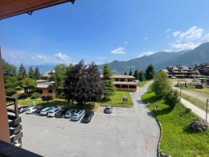 arial view of a parking lot with cars parked at La Splaza Home in Pian Camuno +10 photos