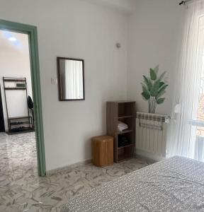 a bedroom with a bed and a mirror on the wall at Mama house in El Marsa